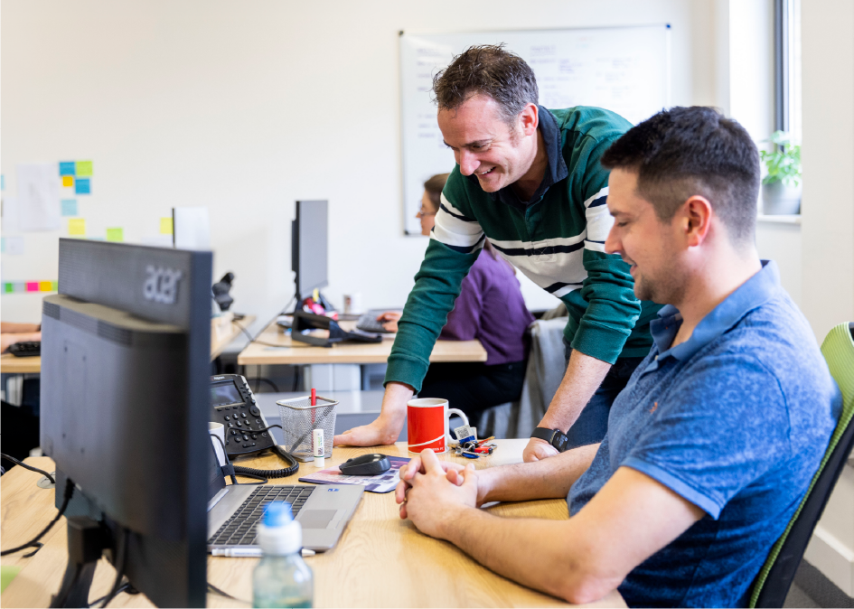 Two men at a computer