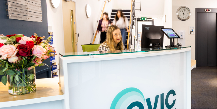 Reception area with a woman behind the desk
